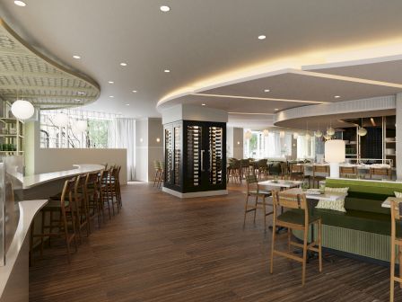A stylish, modern restaurant or lounge with wooden floors, curved white ceiling, warm lighting, bar seating, and green couches, airy and inviting.