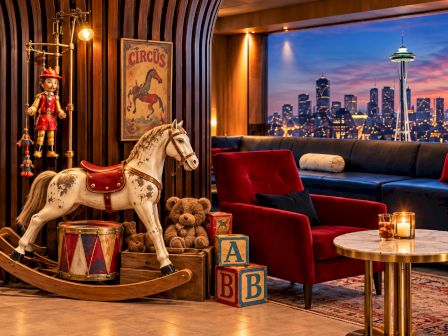 A circus-themed living room with a nutcracker, rocking horse, teddy bears, decorative &ldquo;CIRCUS&rdquo; poster, and a city skyline view.